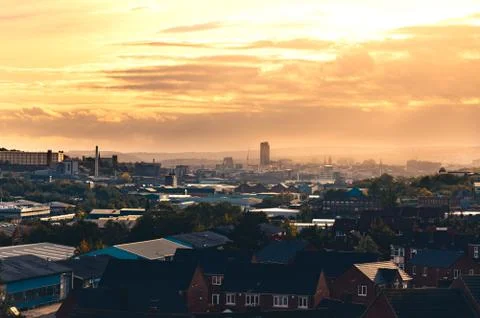 A warm orange sunset behind clouds over Sheffield, South Yorkshire, UK Stock Photos