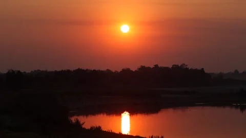 Warm Orange Sunset Over River With Sun Reflection Stock Footage 328529512