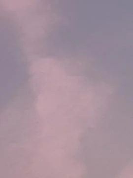 Warm Pink Cloud Texture Across a Soft Dusk Sky Stock Photos