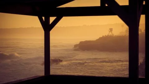 The warm rays of the sun light up the La Jolla coastline in the early morning  Stock Photos