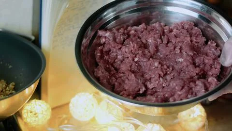 Warm recipe view: adding ground beef to the skillet Stock Photos