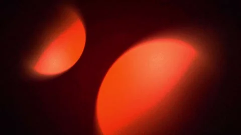 Warm red bokeh glow background with soft blur lights, abstract seamless loop vid Stock-Footage 339264056