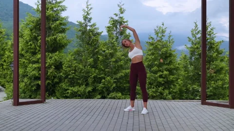 Warm-up routine. Side body bends for stretching Stock Footage 168258041