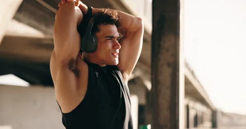 Warm up, runner and headphones with man outdoor for workout start, health radio Stock Footage 332492049