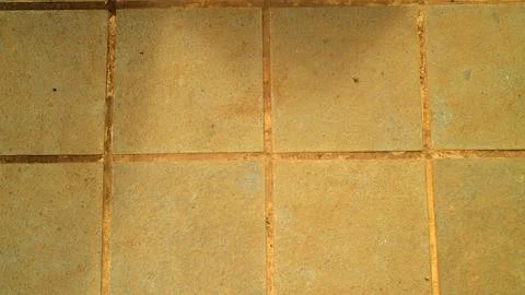 Warm rustic ceramic floor tile pattern background Stock Photos