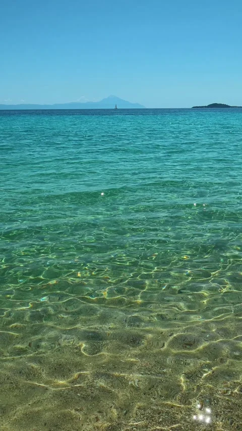 Warm sand meets crystal-clear turquoise waves. Trani Ammouda, Greece. Vertical 스톡 동영상 339629716