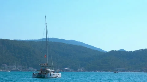 Warm sea waves with sailing one yacht. Stock Footage 304753653