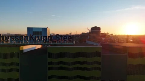 Warm side drift past steel sign at sunrise Stock Footage 331202168