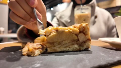 Warm Slice of Apple Pie With Coffee Cup in Cozy Cafe Interior for Morning Snack 스톡 동영상 344918073