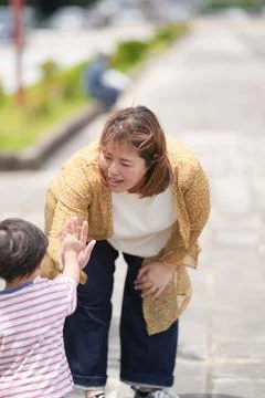 Warm smile shared between mother and child Stock Photos