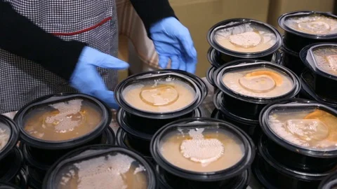 Warm soups in plastic dishes Video stock 105900568