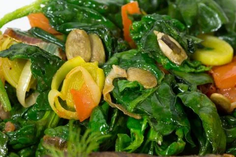 Warm spinach salad with leeks. Stock Photos