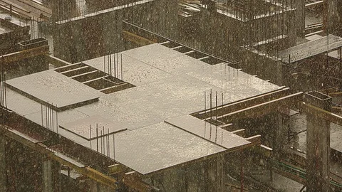 Warm spring rain on a construction site at sunset Stock Footage 88704742