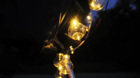 Warm String Lights Attached to Rooftop Tent Creating Cozy Night Camping Mood Stock Footage 325837902