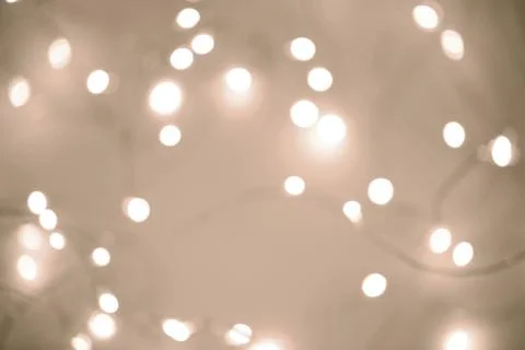 Warm string lights creating a soft, enchanting glow with a mocha and mousse tone Stock Photos