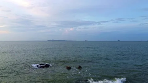 Warm Sunlight Breaking Through Ocean Horizon at Dusk Video stock 326739935