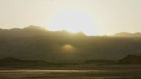 Warm sunlight during sunset or sunrise in Natron Lake in Tanzania Africa Video stock 307717988