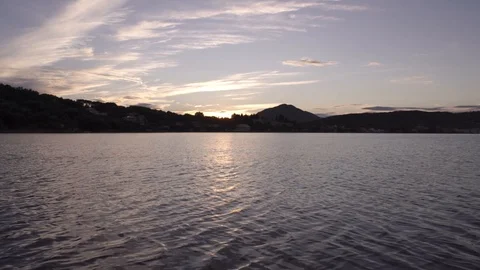 Warm sunset clouds over gentle sea landscape in Corfu Greece Stock Footage 96723088