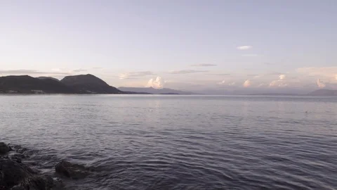 Warm sunset clouds over gentle sea landscape in Corfu Greece Stock Footage 96723142
