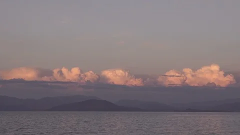 Warm sunset clouds over gentle sea landscape in Corfu Greece Stock Footage 96723173