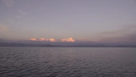 Warm sunset clouds over gentle sea landscape in Corfu Greece Stock Footage 96723220