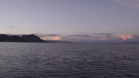 Warm sunset clouds over gentle sea landscape in Corfu Greece Stock Footage 96723240