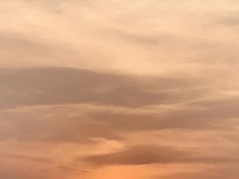Warm Sunset Cloudscape with Layered Evening Colors in Jakarta Indonesia 스톡 사진
