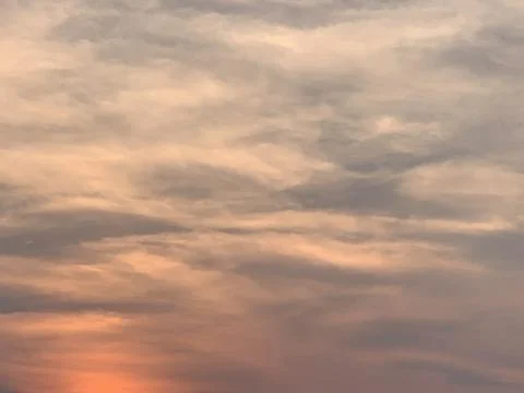 Warm Sunset Cloudscape with Layered Evening Colors in Jakarta Indonesia 스톡 사진