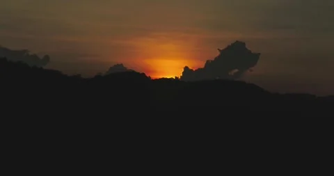 Warm Sunset Glow Across Dense Tropical Jungle Aerial Shot Video stock 332348327