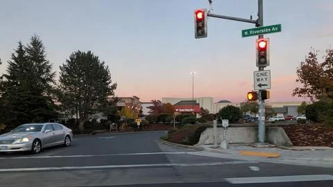 A warm sunset lights the intersection as Rogue Valley Mall and JCPenney Stock Photos