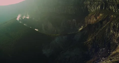 Warm Sunset Over Mountain Range with Light Fog Indonesia Aerial View Stock-Footage 331873926