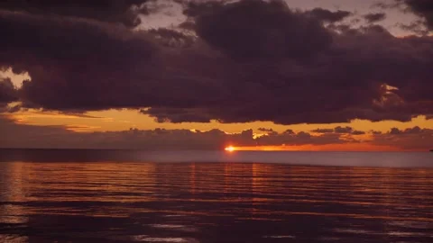 Warm sunset shining over calm sea in bay Video stock 168813433