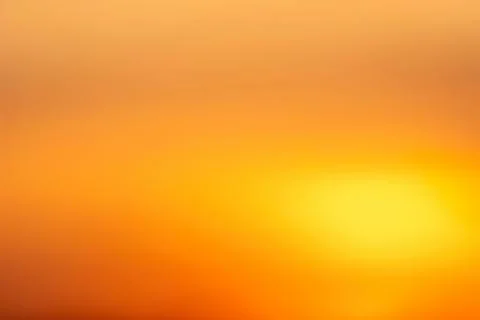 Warm sunset sky with orange and yellow hues Ilustração Stock