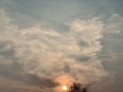 Warm Sunset Sun Shining Behind Clouds and Tree Silhouette Jakarta Stock Image Фото