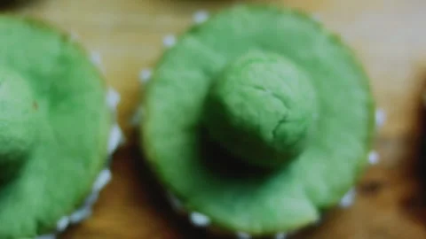 Warm tabletop sequence of textured cookie crowns with white trim Stock Footage 342156219
