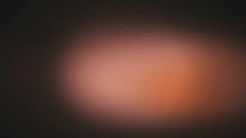 Warm terracotta light leaks drift in a seamless loop 库存影片 341493852