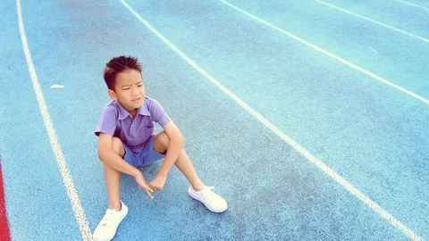 Warm tone Slow Boy give water to sitting boy Stock Footage 78740392
