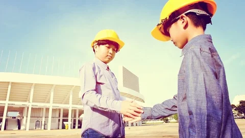 Warm tone with sunlight effect of slow motion two Asian boy helmet Stock Footage 75819358