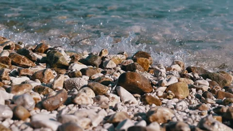 Warm Toned Pebble Beach Waves Stock Footage 293245611