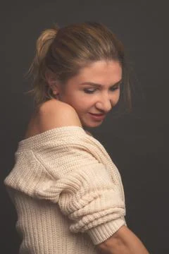 In warm toning, Portrait of a middle aged blonde woman in white clothes on a Stock Photos