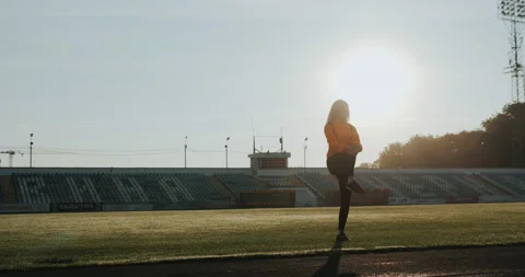 Warm Up before training. jogging in stadium close up Stock Footage 139832439