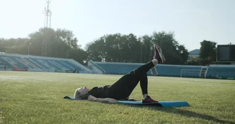Warm Up before training. jogging in stadium close up Stock Footage 139833862