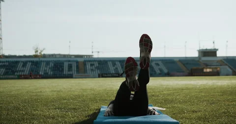 Warm Up before training. jogging in stadium close up Stock Footage 139834017