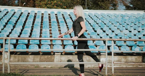 Warm Up before training. jogging in stadium close up Stock Footage 139834273