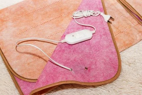 A warm two-sided electric sheet, lies assembled, and on top of sheet lie a .. Stock Photos