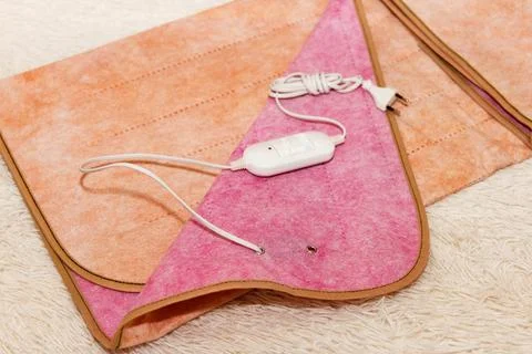 A warm two-sided electric sheet, lies assembled, and on top of sheet lie a .. Stock Photos