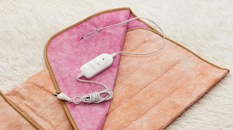 A warm two-sided electric sheet, lies assembled, and on top of sheet lie a .. Stock Photos