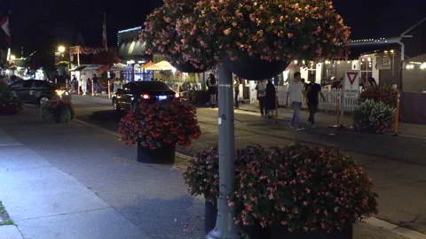 Warm ummer night with people walking and restaurant patios open post COVID 19 Stock Footage 158474090