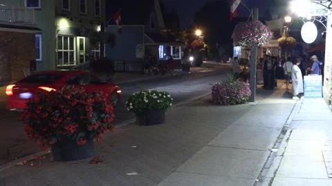 Warm ummer night with people walking and restaurant patios open post COVID 19 Stock Footage 158475129