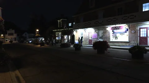 Warm ummer night with people walking and restaurant patios open post COVID 19 Vídeo Stock 158493648